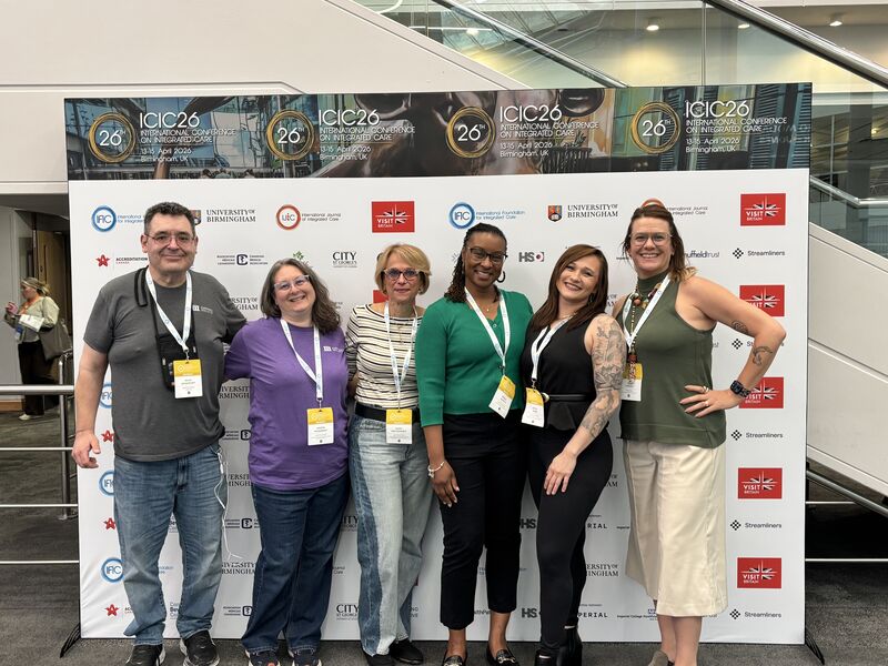 CGI representatives standing in front of a step and repeat at the 2026 International Conference on Integrated Care (ICIC26) in Birmingham, UK, featuring a session on workforce capacity and inclusion in integrated care.